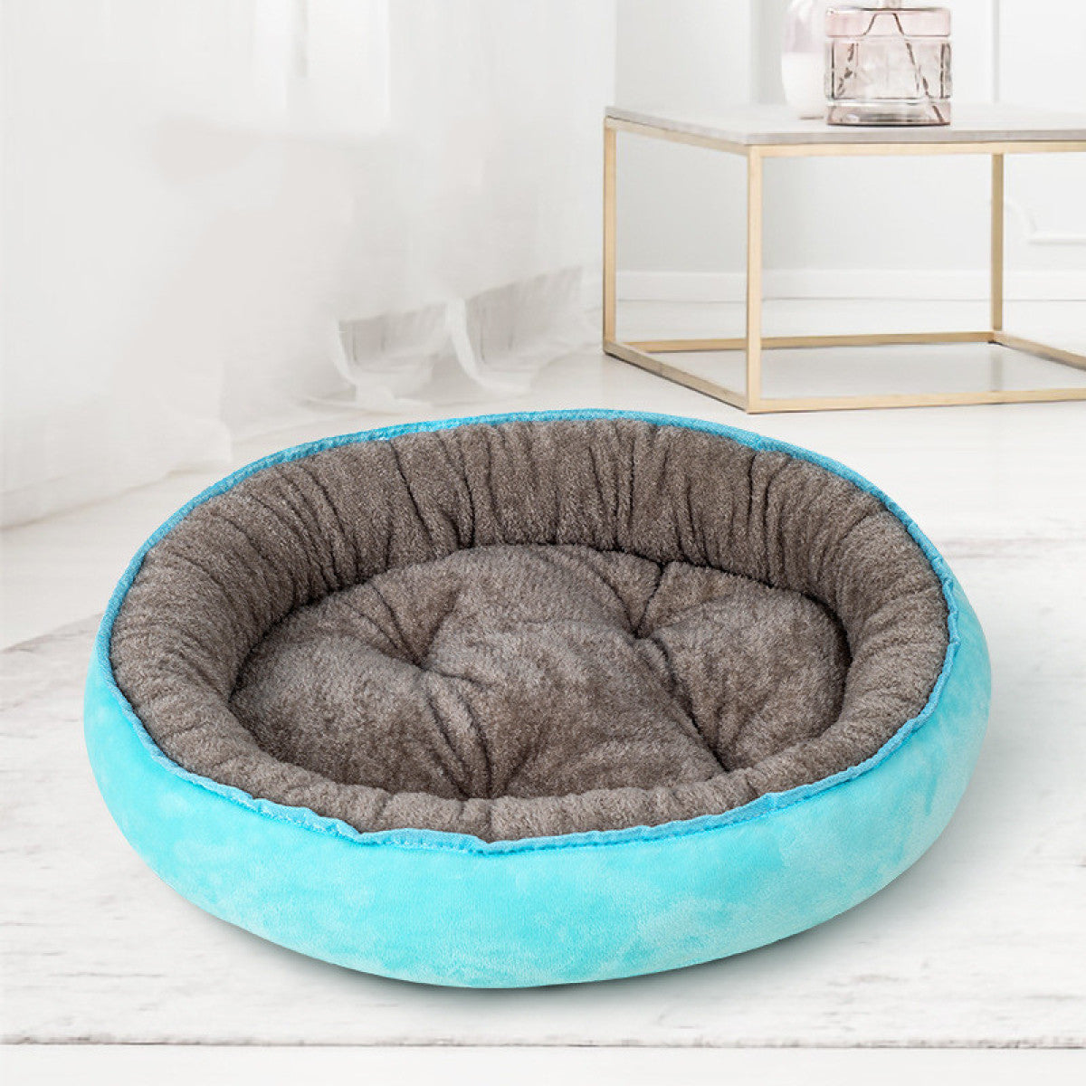 Blue oval plush pet bed, L, 56 by 50 cm, with grey-brown interior